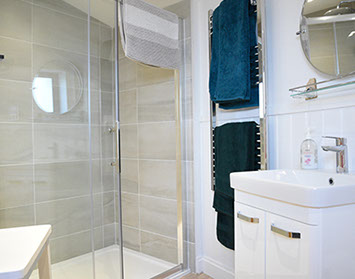 Our Self Catering accommodation contains an en suite bathroom with walk in shower sink and toilet
