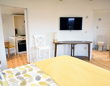 Our modern self catering accomodation contains a king size bed en suite bathroom and modern well equipped kitchen